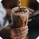Chocolate milkshake in hand